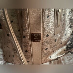 Gently Used 100% Authentic Metallic MCM Tote. Small stain shown $450 OBO
